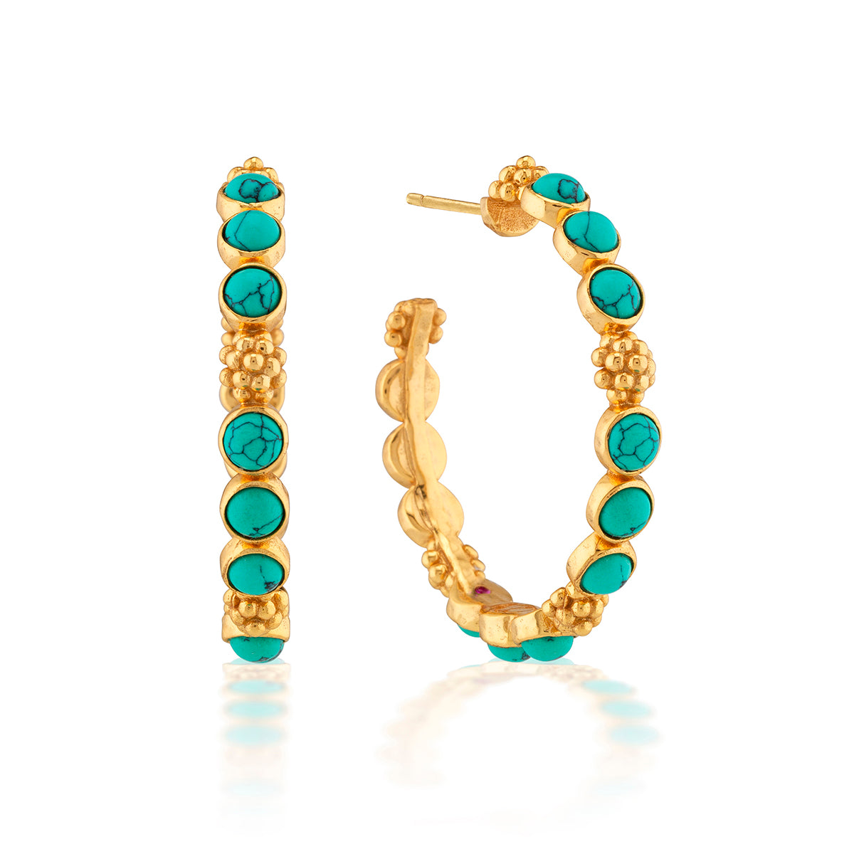 Classic hoop earrings are adorned with vibrant turquoise orbs and a sprinkling of golden berries for a look that’s polished, bohemian, and chic. These hoops add a fabulously feminine flourish to any ensemble—whether you’re running a meeting, hosting a dinner party or jet-setting to Santa Fe.