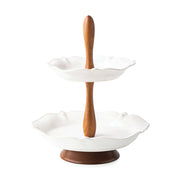 Rimmed with a simple thread and adorned with a sprinkling of berries, this iconic dinnerware collection embraces the historic motifs of our Bohemian glassware. This tiered serving stand features a combination of ash wood handle and foot, with two ceramic rimmed trays with subtle scallop detail. The wood elements easily unscrew and separate from the ceramic trays for dishwashing. Wood elements should be cleaned with a damp cloth.