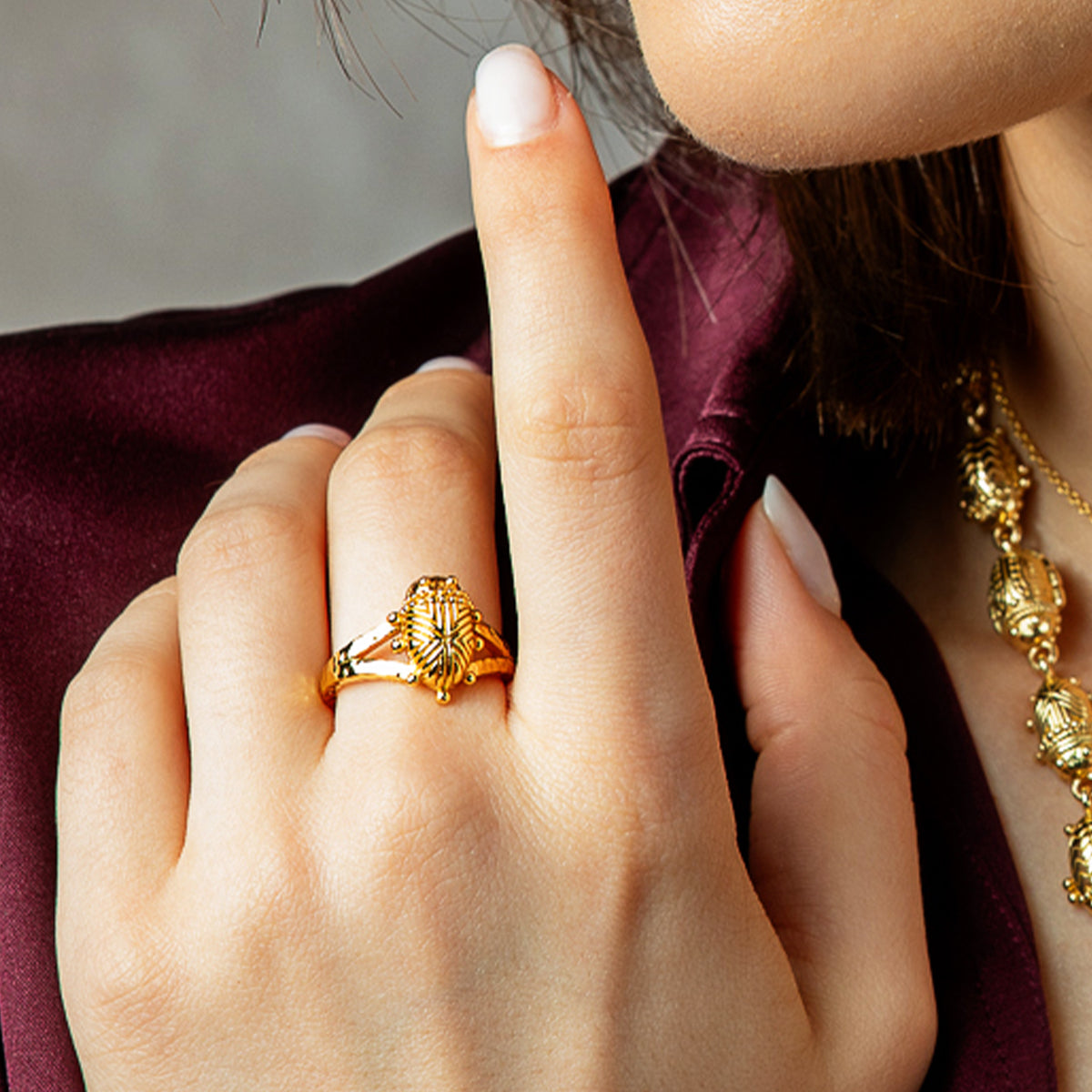 Scarab Gilded Ring - Gold close up of ring on finger