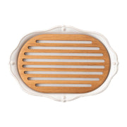 This handsome Challah board  boasts a fluted silhouette trimmed with threads and a  sprinkling  of  berries and  is complete with a  grated tray on top  to  allow for crumbs to fall below and be easily removed for cleanup.    