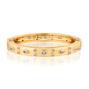 Gold bracelet with embedded cz stones on a white background