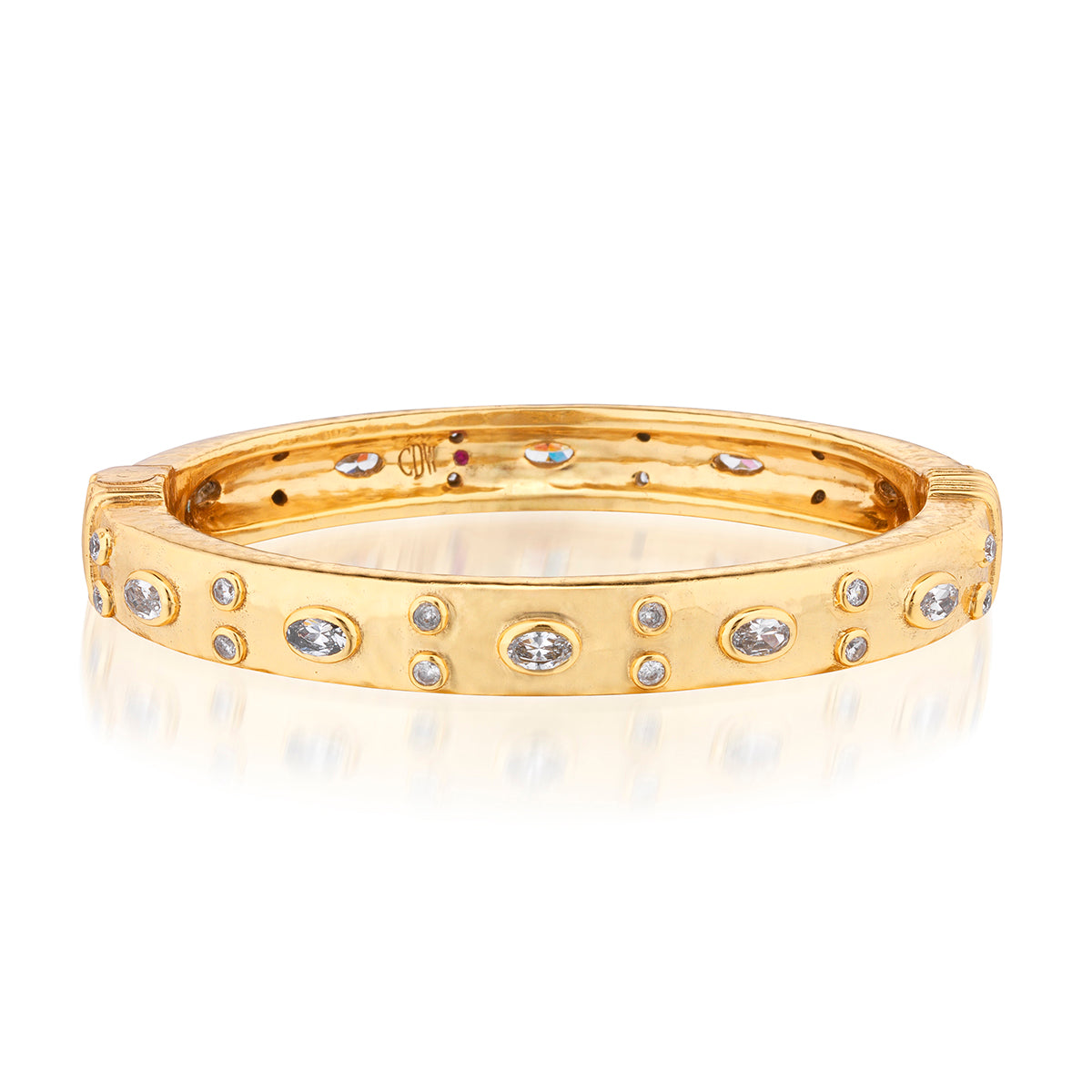 Gold bracelet with embedded cz stones on a white background