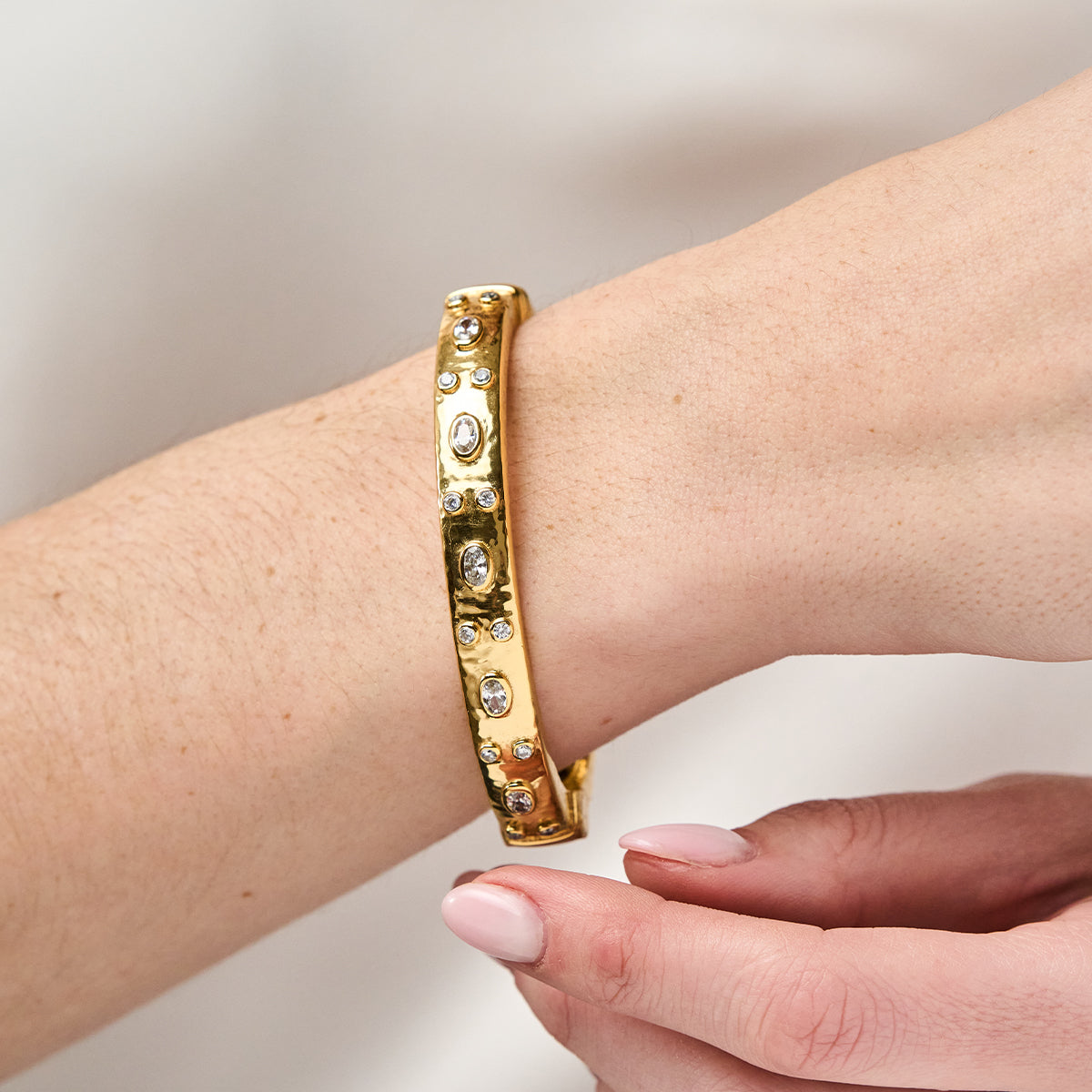 Maharani Hinged Bangle - Clear Cubic Zirconia close up on model