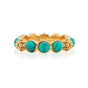 Adorned with lustrous drops of mother of turquoise orbs and a sprinkling of golden berries for a look that is polished and feminine, this ring adds a fabulous flourish to any ensemble—whether you’re running a meeting, hosting a dinner party or jet-setting to Santa Fe. Equally sweet and sophisticated, it’s equally lovely on its own or in a stack.