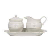 This charming creamer and sugar set sits atop a tray and is adorned with our iconic thread &amp; berries for an enduringly classic look designed to pair with our teapot and mix seamlessly with our other collections. Featuring artisanal elegance and our signature whitewash glaze, you'll want to keep this chic set on the countertop or breakfast table for your everyday coffee and tea and your special occasions alike.