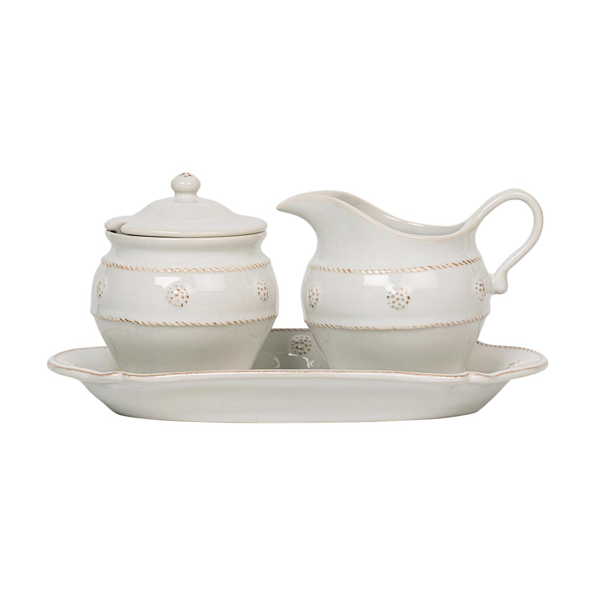 This charming creamer and sugar set sits atop a tray and is adorned with our iconic thread &amp; berries for an enduringly classic look designed to pair with our teapot and mix seamlessly with our other collections. Featuring artisanal elegance and our signature whitewash glaze, you'll want to keep this chic set on the countertop or breakfast table for your everyday coffee and tea and your special occasions alike.