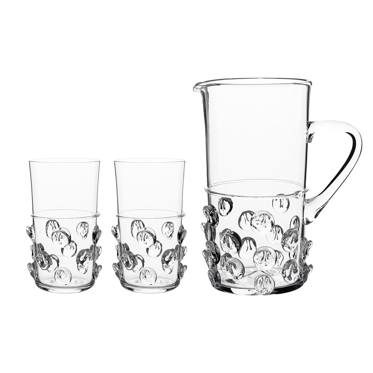 A stunning gift for the person who has everything, this exquisite set of artisanal mouth-blown glass in our historic bohemian 'prunt' motif, is beyond compare. Each piece is signed by our master glass artists and bedecked in indulgent droplets that are opulent, fun, and irresistibly tactile. Certain to spark conversations and make an occasion of any moment, our substantially sized pitcher and matching duo of highball glasses come beautifully packaged in our signature Juliska gift box. Cue the fanfare.