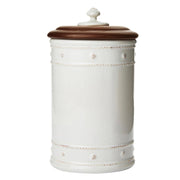 This small jar is adorned in our rich basket weave motif and capped with an Ash Wood lid.