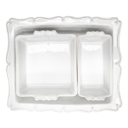 This space-efficient nesting trio is a triumph for home bakers! Practical and pretty, our oversized 17” rectangular baker features a beautiful scalloped edge reminiscent of a ruffled apron, and can snugly accommodate our loaf pan (Baker? Loaf baker? Need to keep consistent) and square baker, to easily fit all three together in your cupboard. Perfect for beloved holiday recipes and for feeding a crowd -- and those lovely handles make taking these dishes from the oven to the table…and easy as pie!