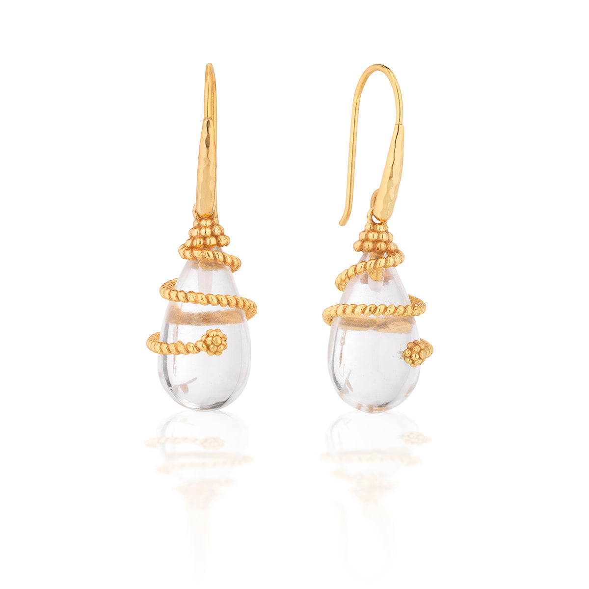 Like a drop of sparkling dew that nourishes everything it touches, even the smallest act of kindness has immeasurable ripple effects. Equal parts elegant and bohemian, these luscious drops of natural clear quartz make a subtle statement with whatever you pair them with. Embellished with a dancing swirl of twisting gold tread, these versatile statement earrings will be your go-to’s for day to night, weekday to weekend styling.
