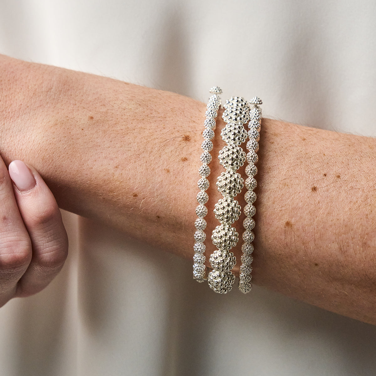 Berry Eternity Petite Hinged Bangle, S/M - Silver bracelet stack on wrist