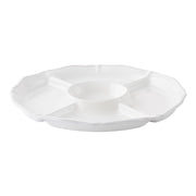 With a handy center vessel for dipping and four compartments trimmed with a scalloped edge, and our thread and berry motif, this platter elevates the humble crudites; offering to something much more elegant. Set against our luxe whitewash backdrop, whipping up a beautiful appetizer is a snap - we like to play with the season's brightest stars to create a vibrant palette of color - from spring radishes to whimsical pea tendrils and deep purple carrots.