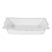 Our oversized 17” rectangular baker features a beautiful, scalloped edge reminiscent of a ruffled apron, perfect for presenting beloved recipes on special occasions or for everyday use. Abundantly sized to feed a crowd and designed to snugly accommodate both our loaf pan (Baker? Need to keep consistent with above) and square baker -- blessedly fitting all three together in your cupboard for space-efficiency.