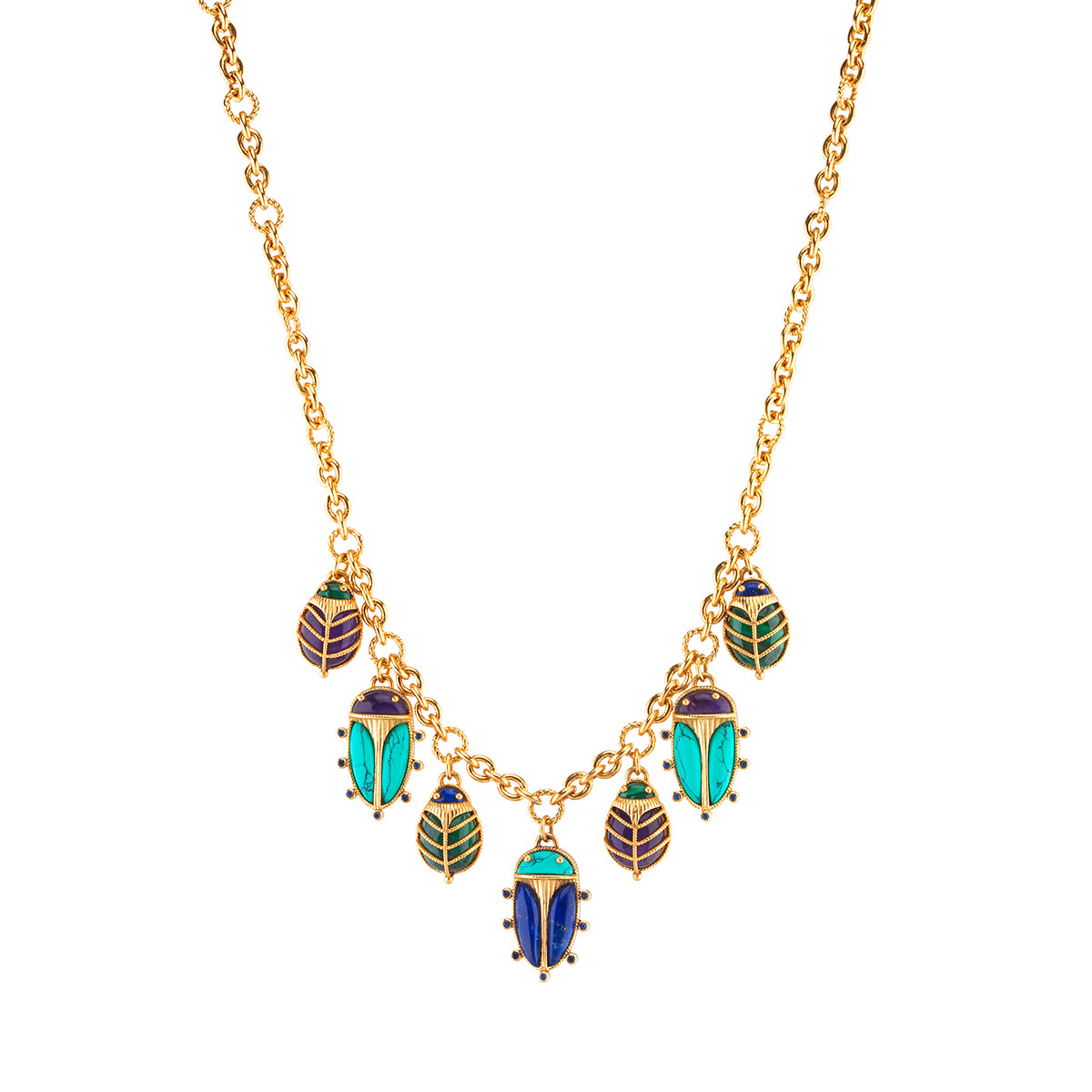 A sacred ancient Egyptian symbol of strength and resilience, these irresistible scarabs are hand crafted with vibrant jewels with swaying movement as they flip playfully throughout the day (or while dancing in moonlight) to reveal golden underbellies with radiant sunbursts. Just like all families, each charming creature is similar and unique, with intricate gilded exoskeletons and vibrant hand-carved wings and heads in a riot of colorful amethyst, lapis, malachite and turquoise.