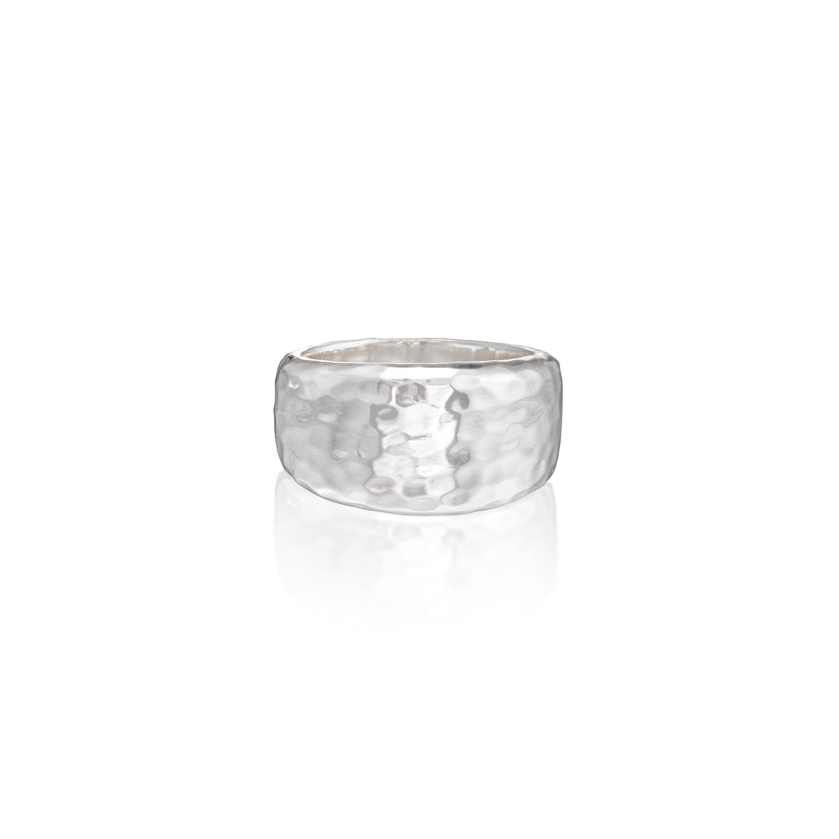 A hammered silver band ring with a textured, dimpled surface, shown on a clean white background with a soft reflection below.