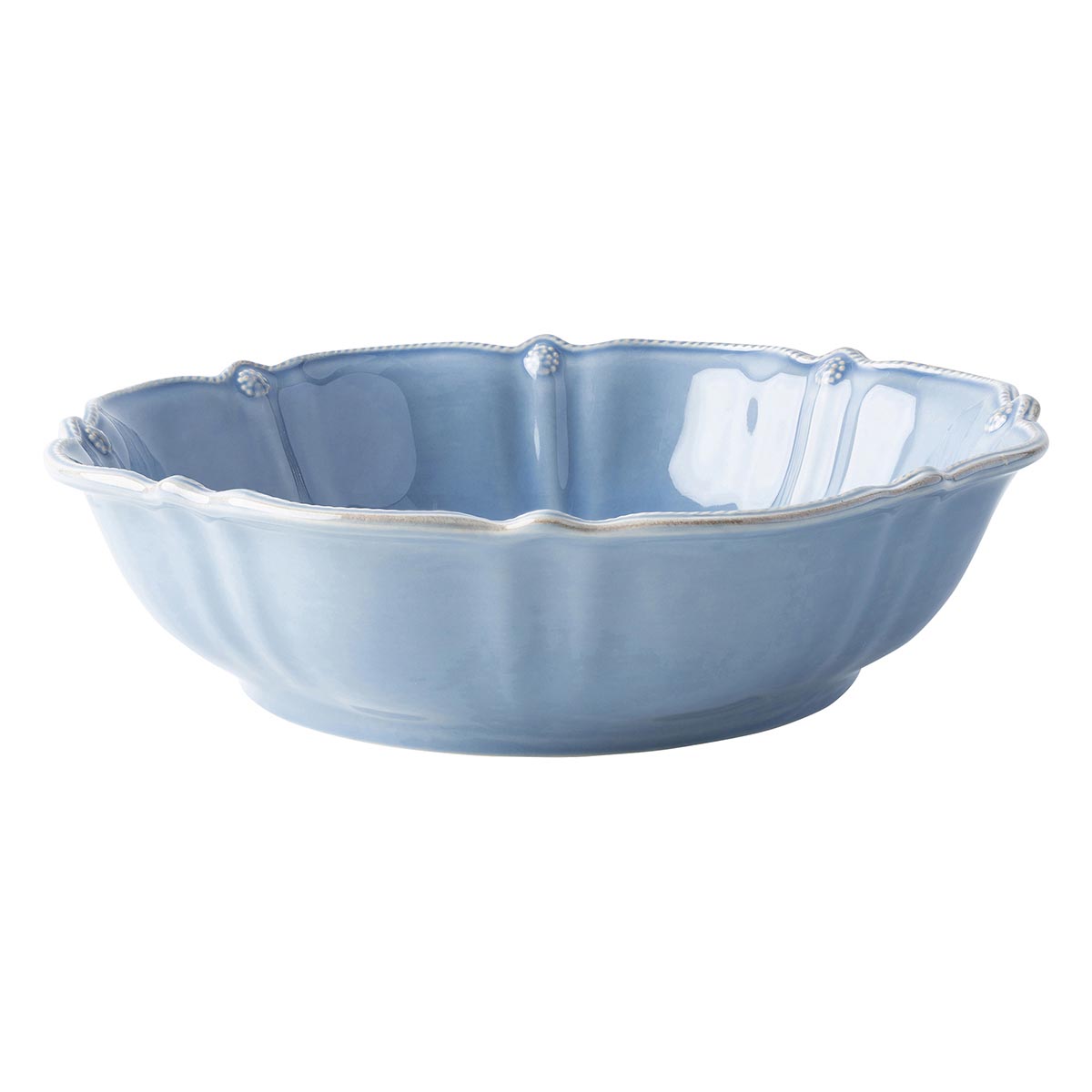 Blue serving bowl with berries and thread rim.