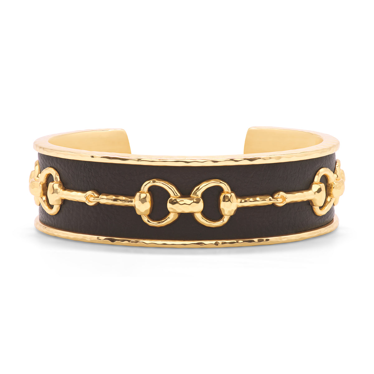 Gold cuff with a snaffle bit design over dark leather.