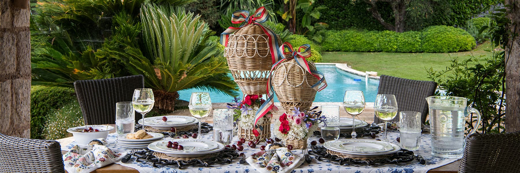 An outdoor gathering with Juliska dinnerware.
