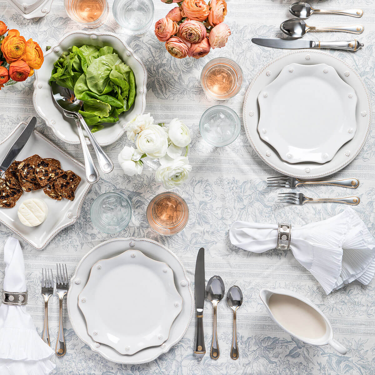 Berry & Thread whitewash dinner place settings on a white tablecloth