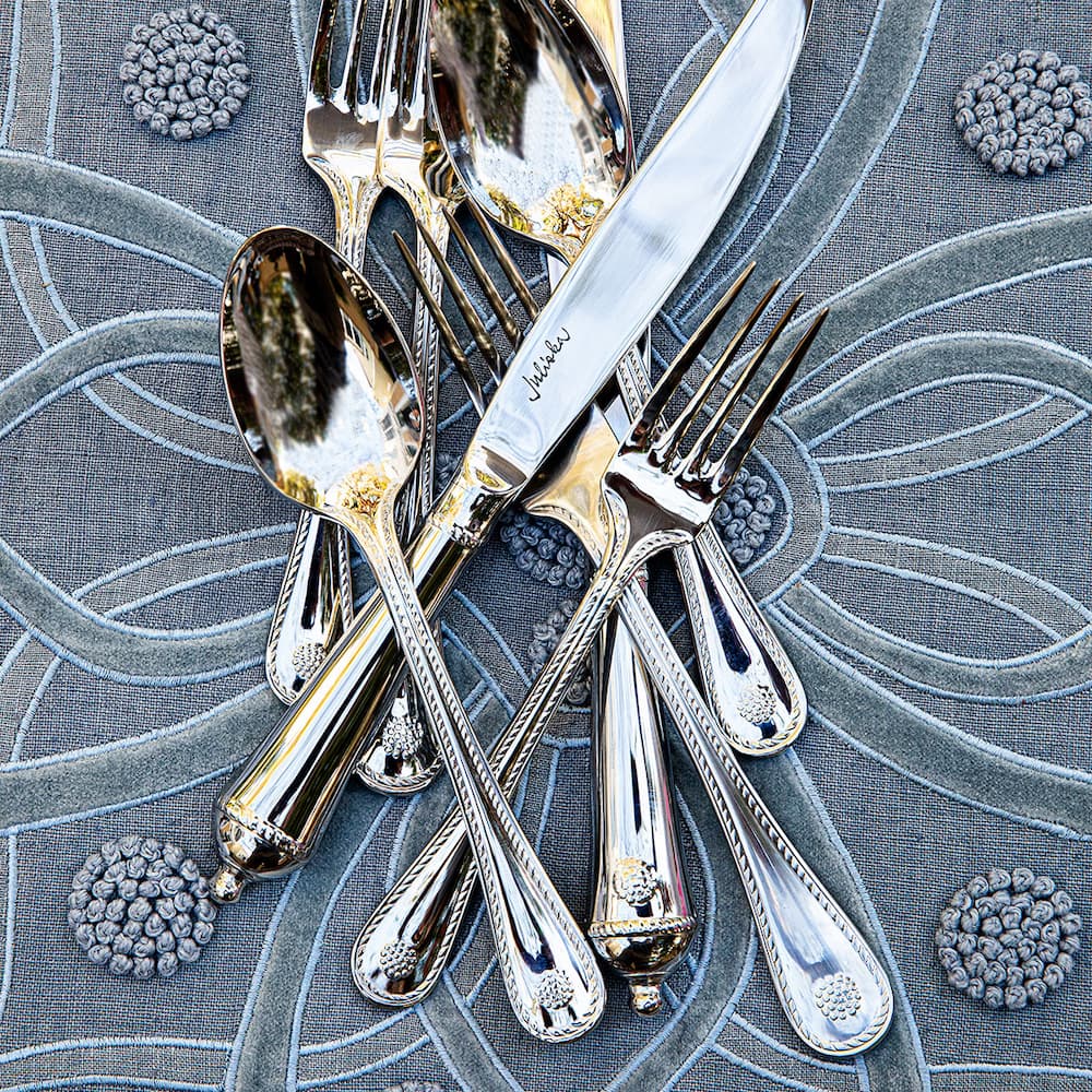 Berry and Thread flatware on chambray fabric.