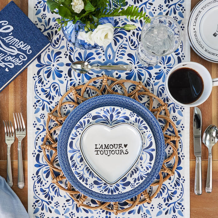 Place setting featuring variety of blue ceramics and linens from Iberian, Le Panier and L'Amour Toujours collections.