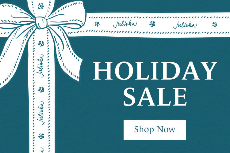Promotional graphic with 'Holiday Sale' text and a white ribbon on a teal background.