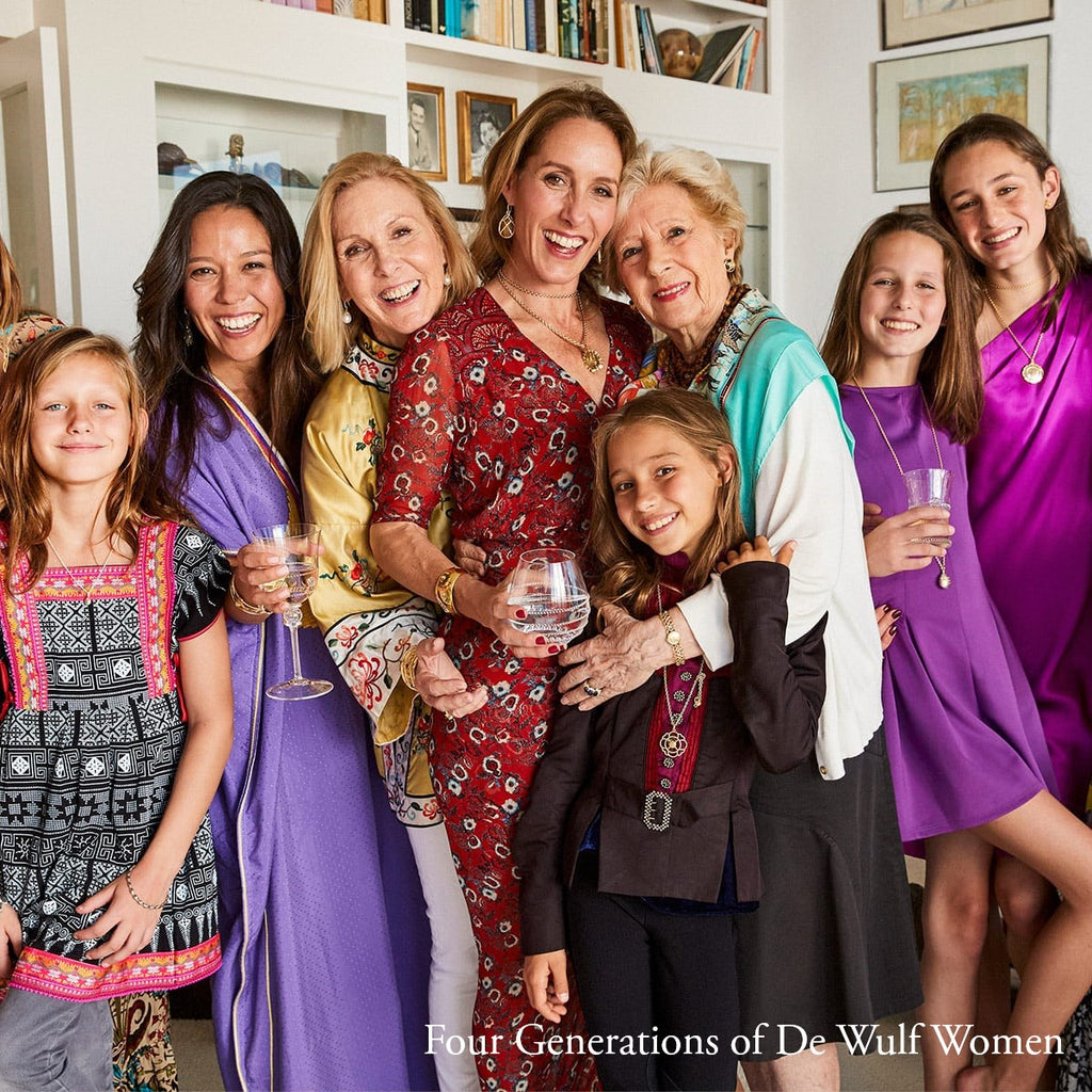 Four generations of De Wulf women gather together and smile.