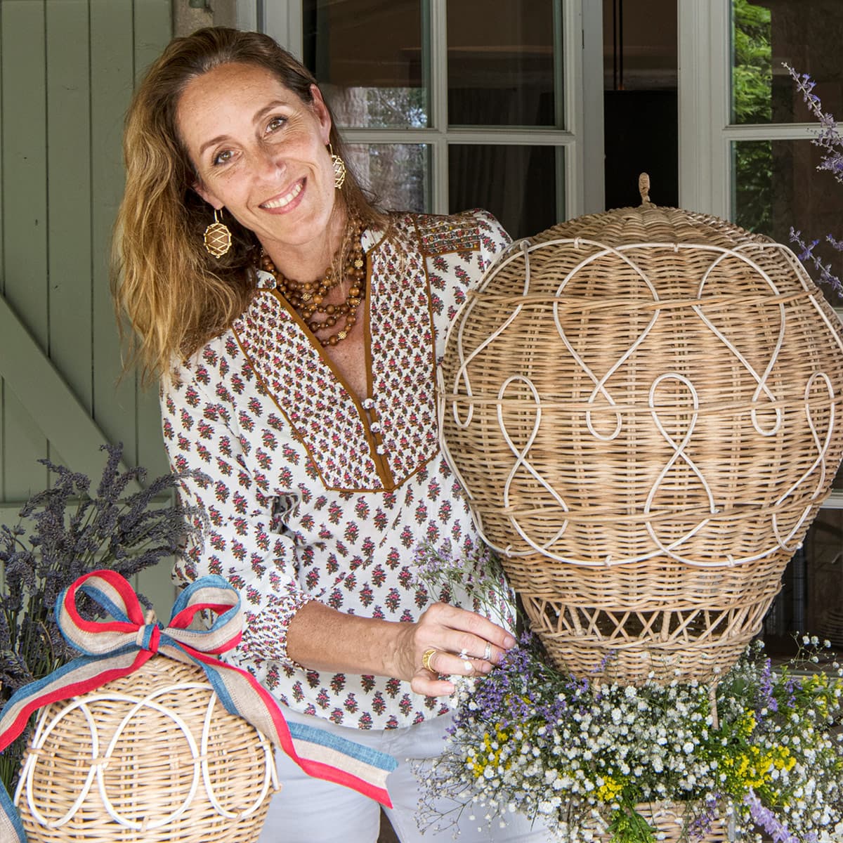 Capucine De Wulf Gooding poses with rattan hot air balloons.