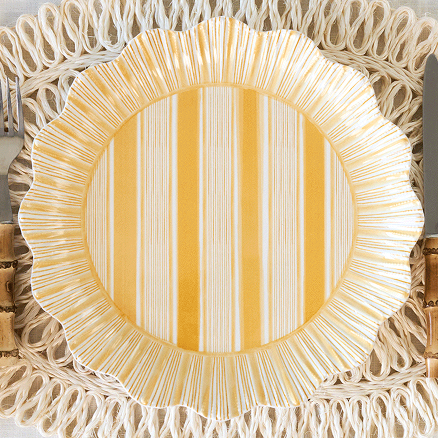 Moveable gif of melamine cabana, berry & thread, and sofia collection plates on a rattan placemat.