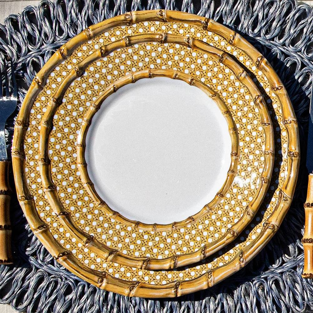 Two Bamboo melamine plates on a blue rattan placemat