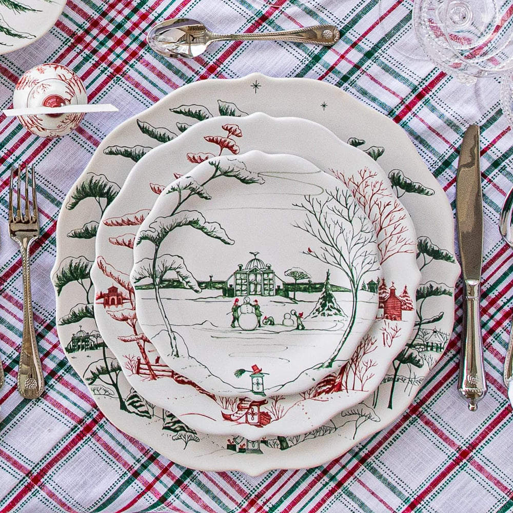 Country estate winter folic ruby and evergreen plates on a festive tablecloth