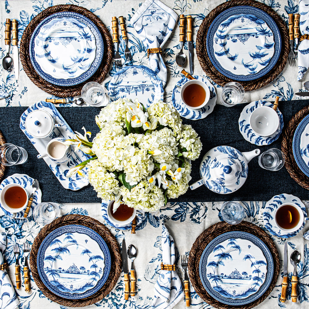 An overhead photo of a blue and white tablescape.