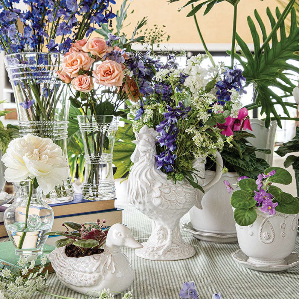 Beautiful florals arranged in whimsical vases.