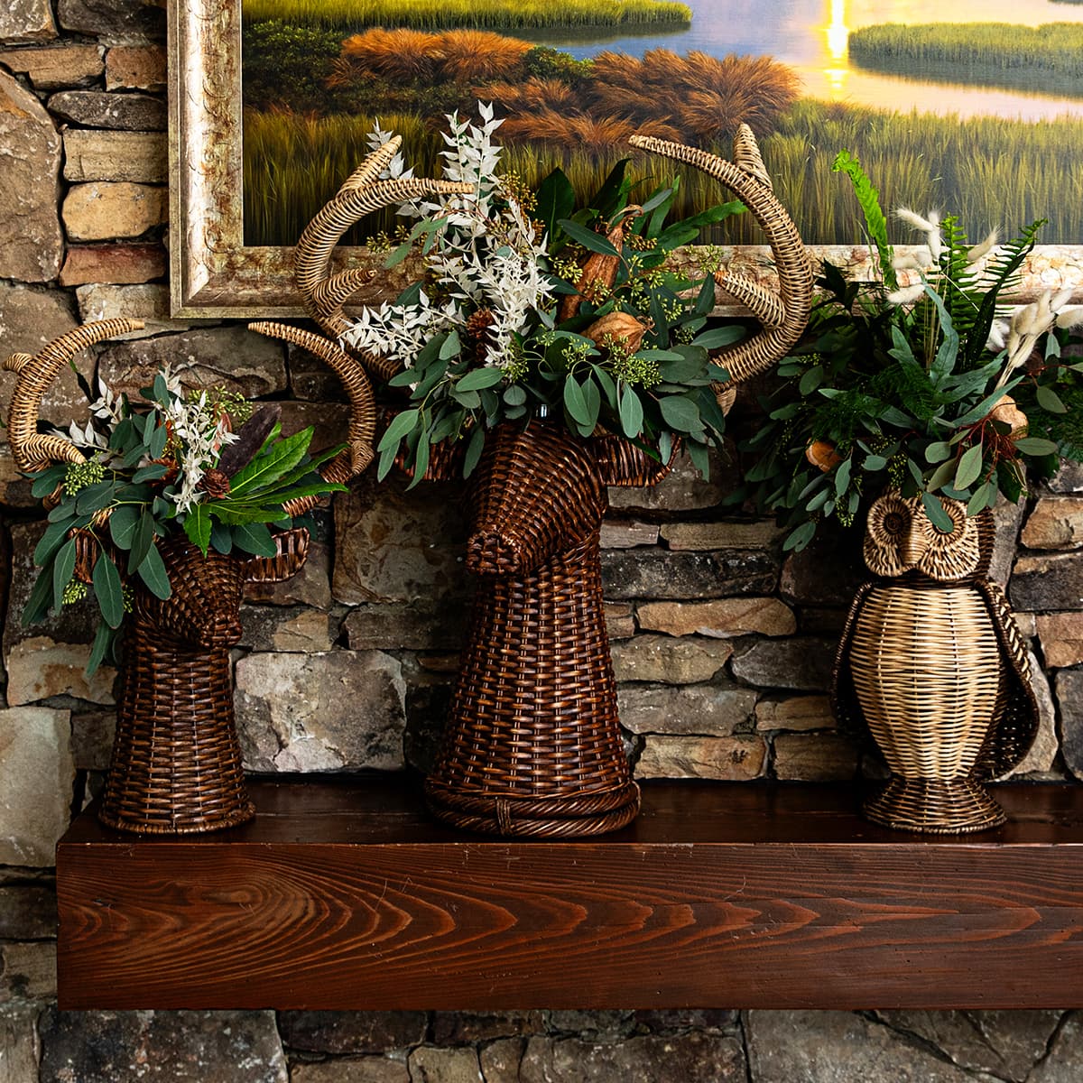 Devon willow stags and owl filled with plants displayed on a mantel