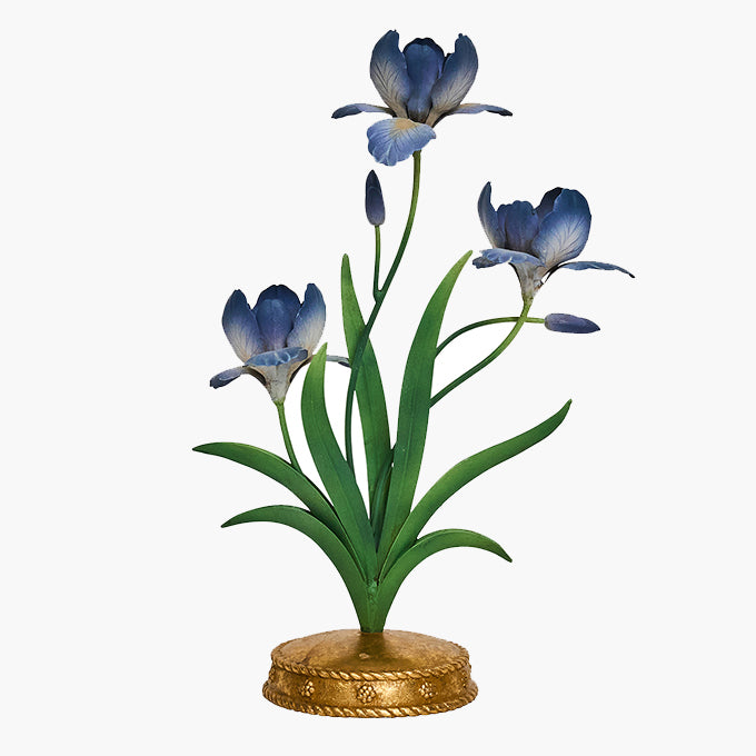 Decorative metal flower candleabra with blue flowers on a white background