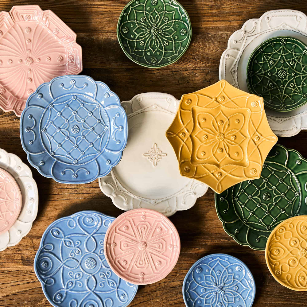 Colorful ceramic plates with intricate designs on a wooden surface