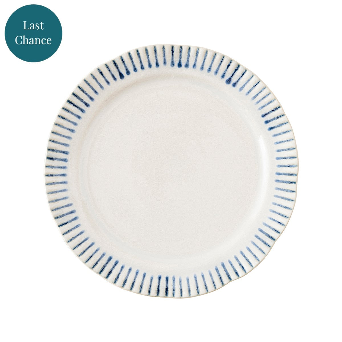 White plate with blue stripes painted along the rim.