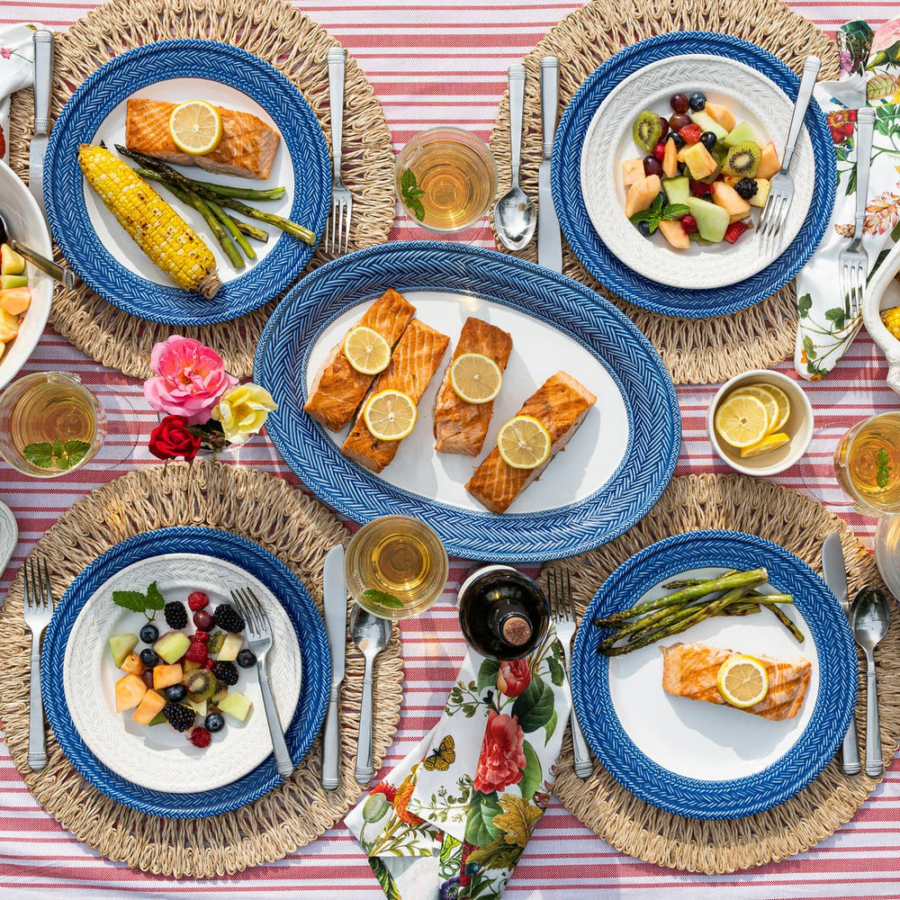 Create an party with a blue and white table setting.