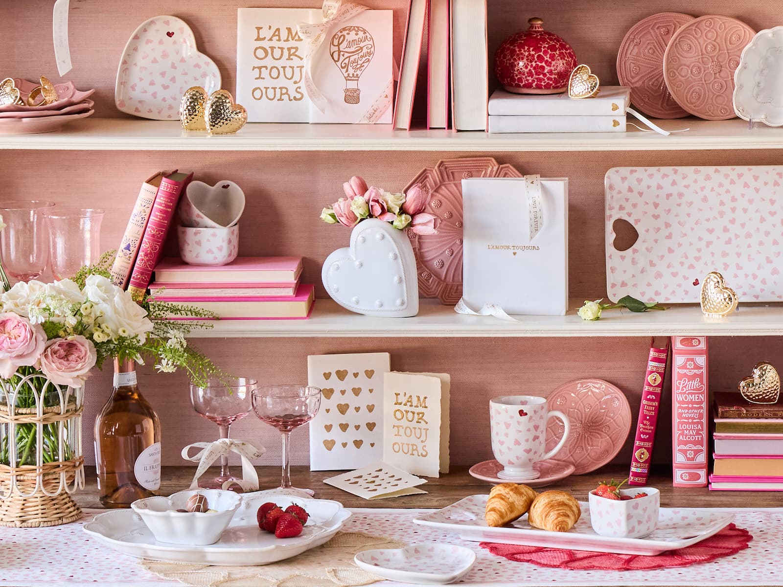 Decorative shelves with pink and white home decor items on a wooden surface.