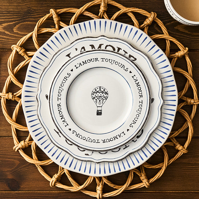 Decorative plate with blue text and design on a woven placemat