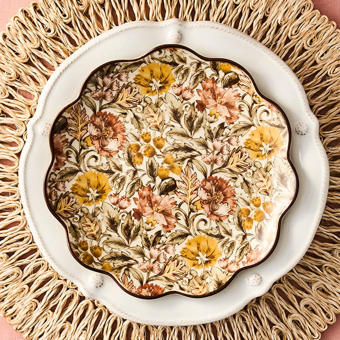 Decorative plate with floral pattern on a textured surface