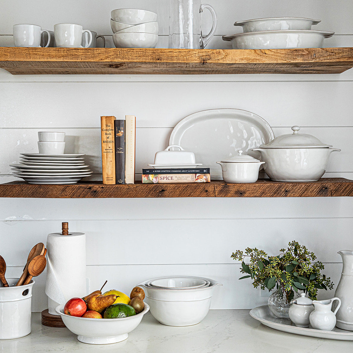 Juliska Puro serveware and bakeware displayed on floating cabinets 