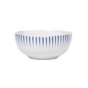 The classic white cereal/ice cream bowl is enlivened with a sculptural rim clad in radiant stripes of breezy Delft blue, making everything from morning oats to sundaes at sunset a little moment to celebrate.