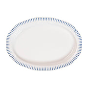 This fresh serving bowl radiates classic beauty with its subtly scalloped rim that is clad in Delft blue stripes to put an exclamation point on whatever it contains, from roasted veggies to charcuterie.