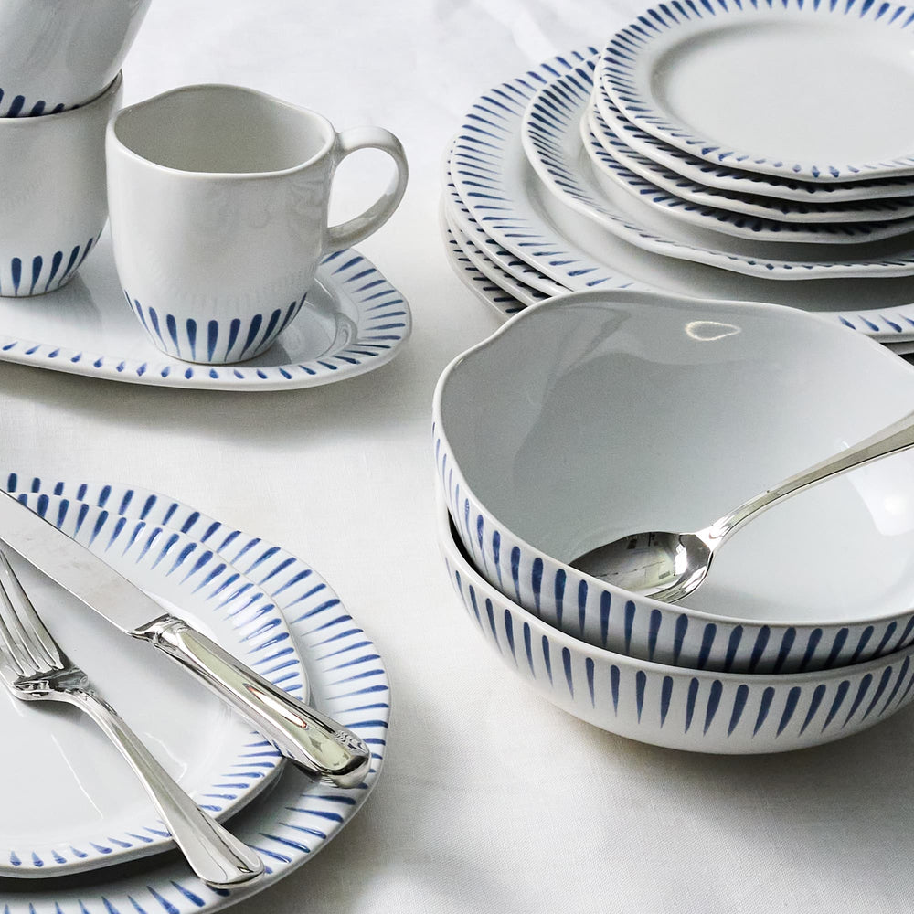 Dishware set with blue and white patterns on a light background