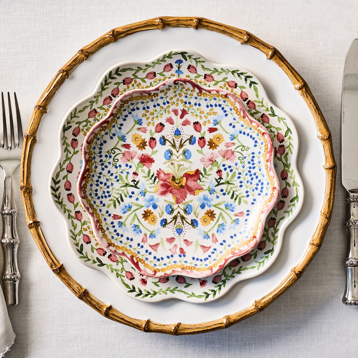 Decorative plate with floral pattern on a table setting with cutlery