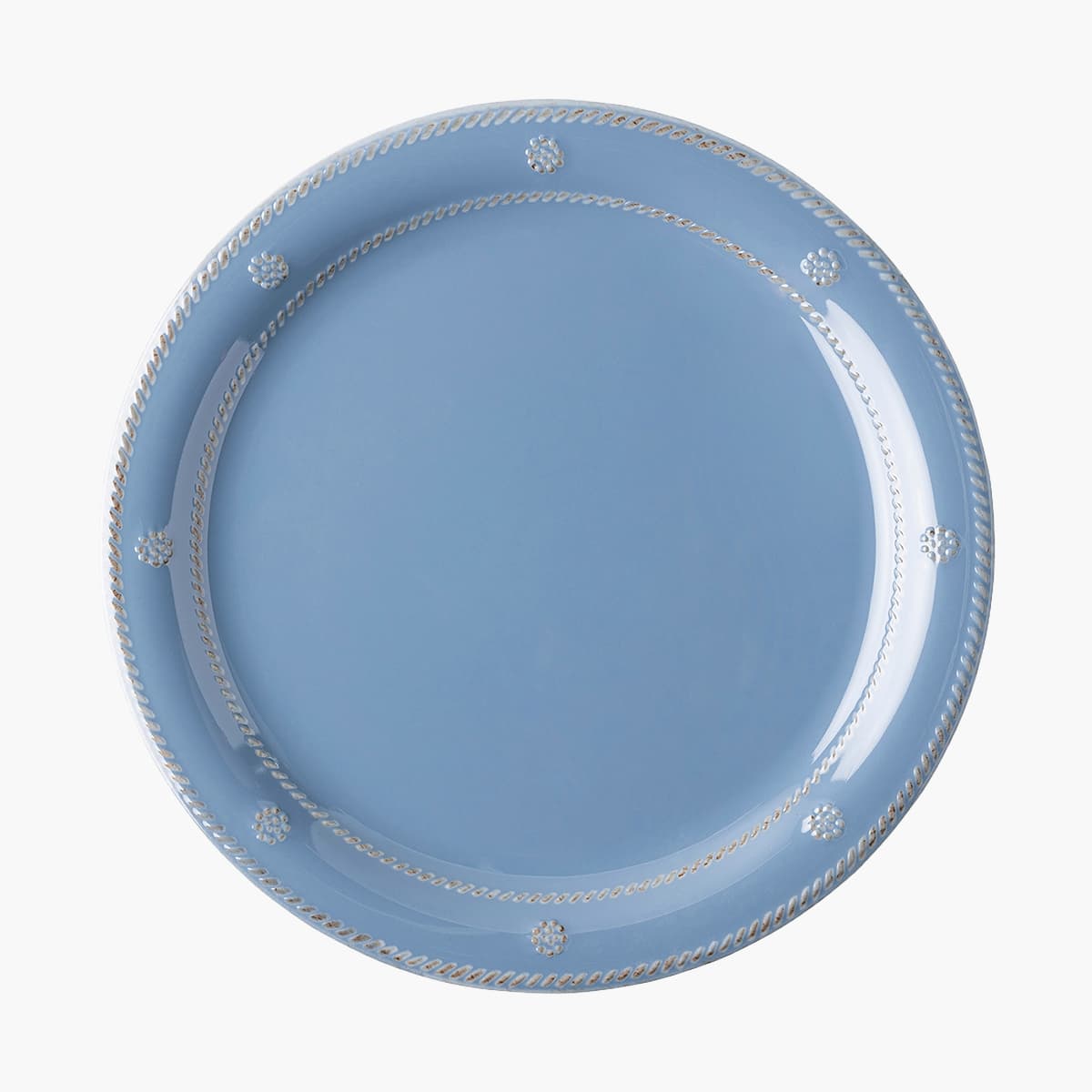 Blue plate with decorative rim on a white background