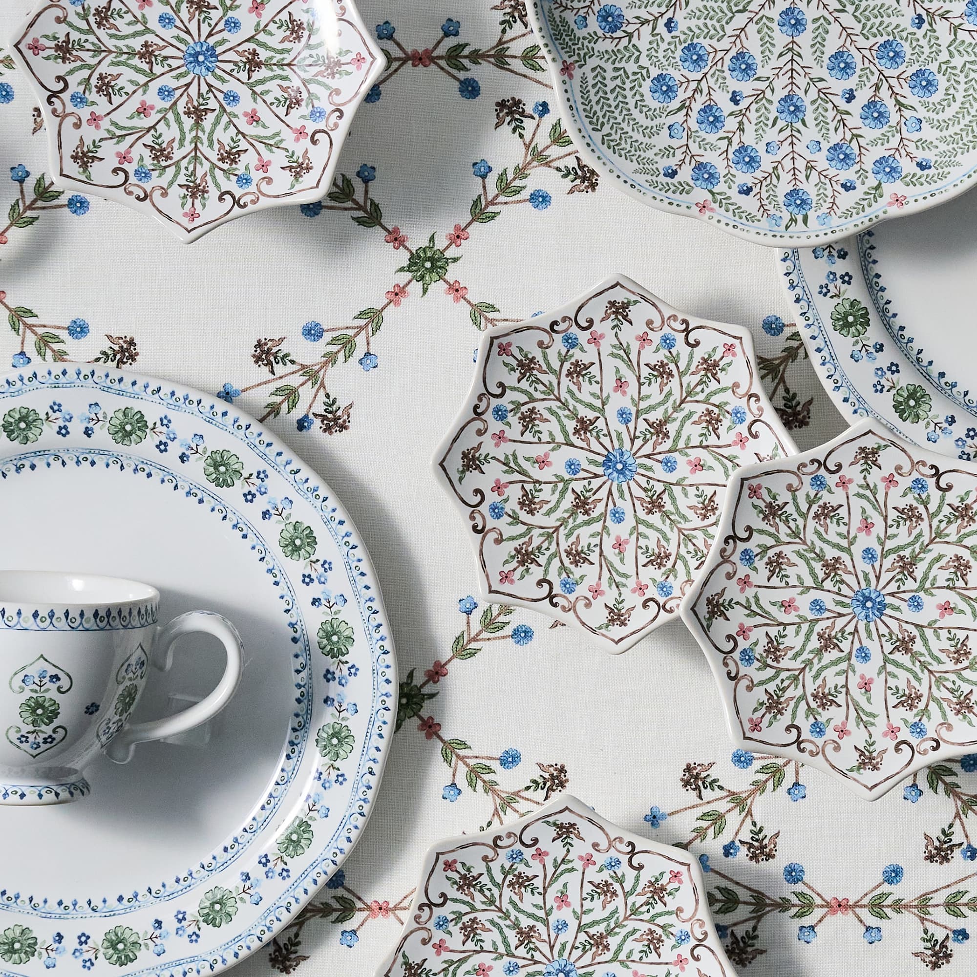Decorative ceramic plates with floral patterns on a white background