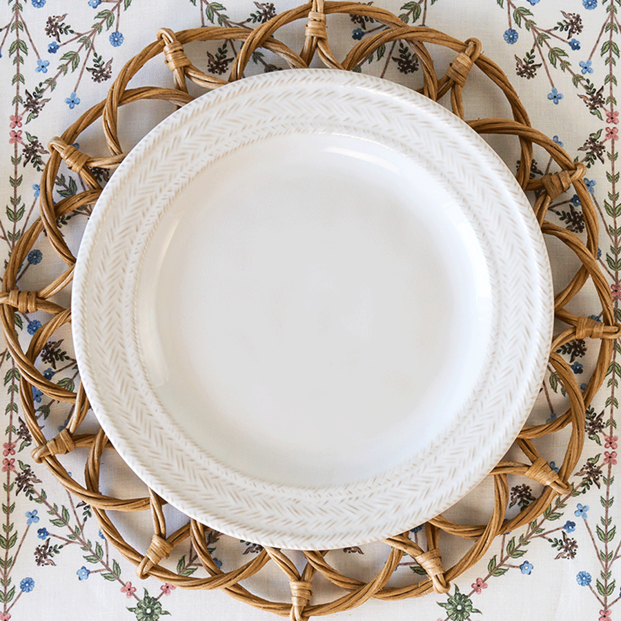 Moveable gif featuring Villa Seville linens and plates mixed with Le Panier and Sitio Stripe against a rattan placemat