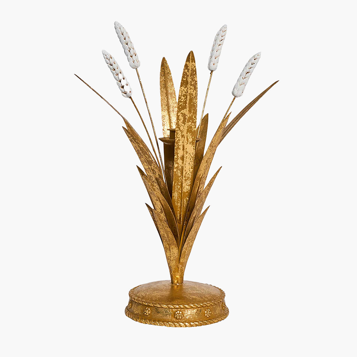 Decorative arrangement with gold leaves and white flowers on a white background
